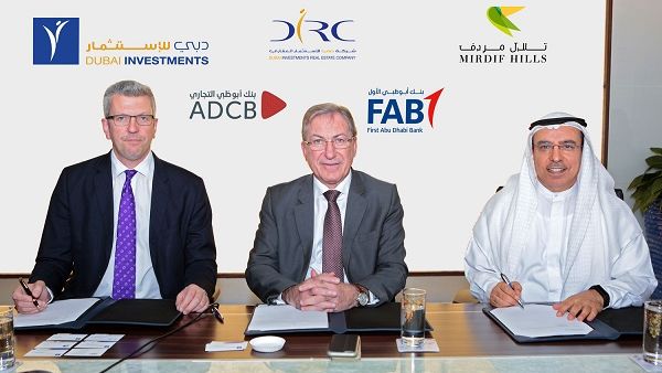 Khalid Bin Kalban, André Sayegh and Colin Fraser signing the project