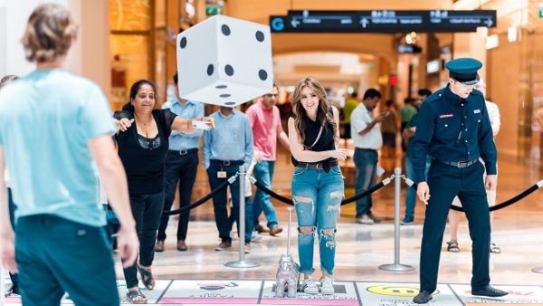 The giant MONOPOLY SMILE game is a life-sized, tailor-made version of the iconic property trading game featuring new elements that are inspired by the happiest city in the world, Dubai. The giant MONOPOLY SMILE game is a life-sized, tailor-made version of the iconic property trading game featuring new elements that are inspired by the happiest city in the world, Dubai.