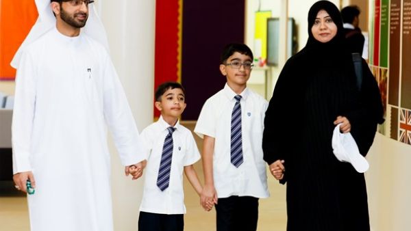 Parents with their children who received the scholarship. Parents with their children who received the scholarship.