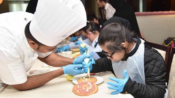During their visit, the 20 children from Shafallah Center for Persons with Disabilities, learned cookie making class from the hotel’s team members at the Teatro restaurant.