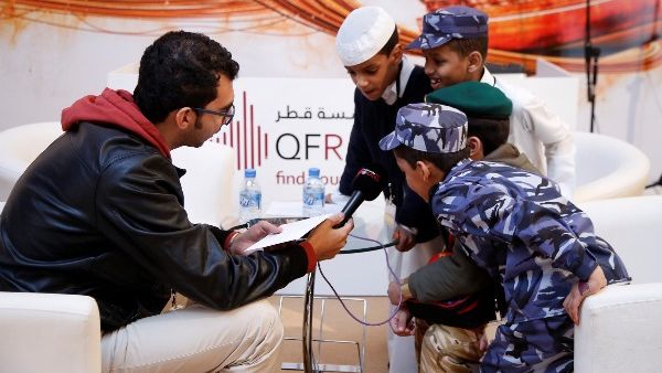 A group of young boys send a message to Qatar on National Day at the QF Radio booth at Qatar Foundation for Education, Science and Community Development’s (QF) Darb El-Saai tent. A group of young boys send a message to Qatar on National Day at the QF Radio booth at Qatar Foundation for Education, Science and Community Development’s (QF) Darb El-Saai tent.