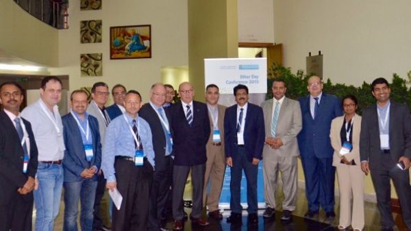 The organizing committee of the conference and speakers pose for a group photo