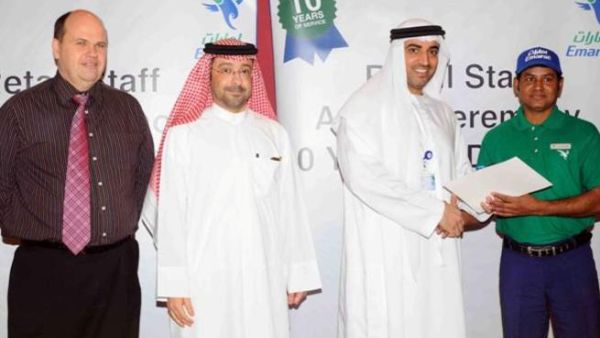 Dr. Rahma honors a staff member in the presence of Abdulla Al Noman, and Darren Smith Dr. Rahma honors a staff member in the presence of Abdulla Al Noman, and Darren Smith