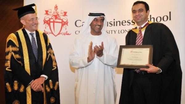 Sheikh Ahmed bin Saeed Al Maktoum and Professor Paul Curran delivering the Cass Executive MBA degree to a student Sheikh Ahmed bin Saeed Al Maktoum and Professor Paul Curran delivering the Cass Executive MBA degree to a student