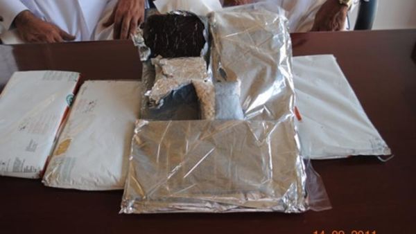 The two smugglers with the seized drugs The two smugglers with the seized drugs