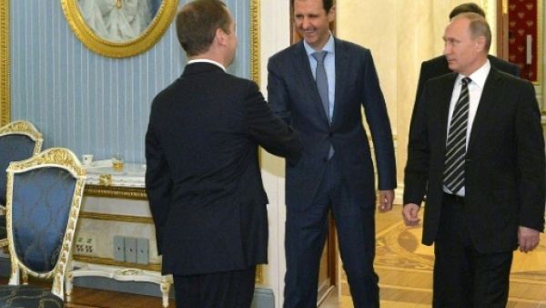 الرئيس السوري بشار الاسد خلال زيارته الى موسكو ولقائه مع بوتين