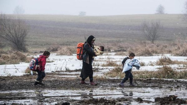 Migrants and refugees walk after crossing the Macedonian border into Serbia. (AFP/File)