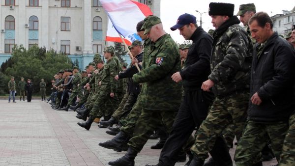Russian soldiers and pro-Russian volunteers during a military parade rehearsal in preparation for the Victory Day parade in Simferopol, Crimea, on April 12, 2014. (AFP/Yuri Lashov)