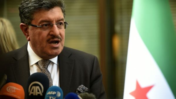 High Negotiations Committee (HNC) spokesman Salem al-Meslet speaks during a press conference on the eve of the second round of Syrian peace talks in Geneva on March 13, 2016. (AFP/Philippe Desmazes)