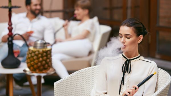 Woman Smoking Shisha (Shutterstock)