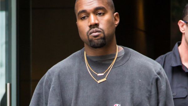 Kanye West cut a call short to wife Kim on Tuesday to engage in a heartfelt chat with the paparazzi. (Source: Liam Goodner / Shutterstock )