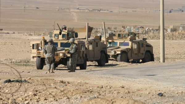 U.S. troops stand guard in a check point in Maxmur, Iraq.. (Shutterstock/ File Photo)