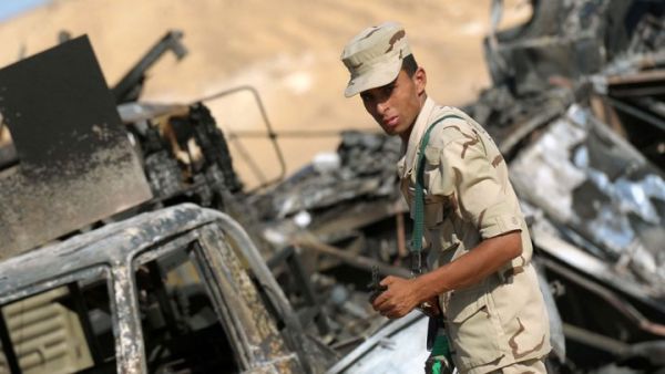 An Egyptian soldier stands guard in an ongoing military operation against militants in the restive Sinai Peninsula (AFP/File Photo)