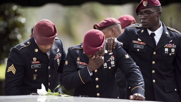 Comrades of Sgt La David Johnson cry at his burial service on 21 October in Hollywood, Florida. Johnson and three other US soldiers were killed in Niger on 4 October. (Gaston de Cardenas/AFP) 