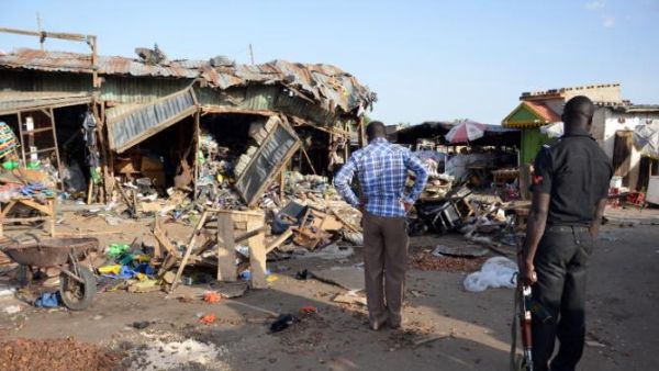 Residents look at the aftermath of another suicide bombing in Maiduguri, Nigeria. (AFP/File)