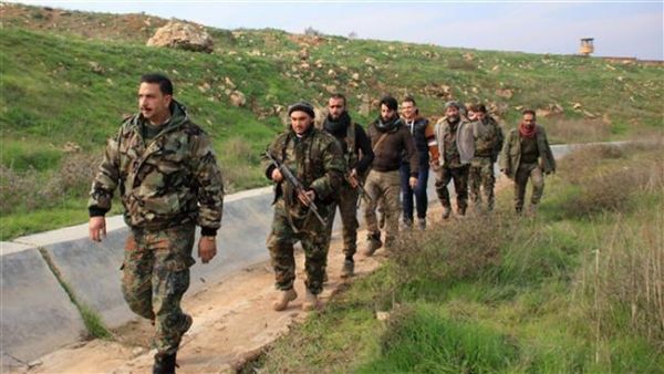 Syrian soldiers and local pro-government fighters patrol the Handarat region, located in northwestern Syria. (AFP/File)