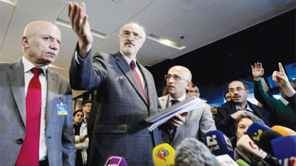 Syrian ambassador to UN and head of the government delegation Bashar Al-Jaafari (center) gestures as he holds a press conference during the Syria peace talks. (AFP/File)