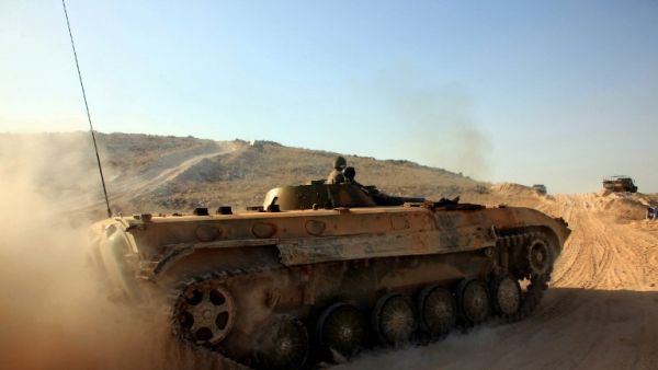 Syrian government forces drive a tank on a road during a military operation against Daesh in the villages of Zarour and Khanaser, in the Aleppo governorate, on February 26, 2016. (AFP/Georges Ourfalian) Syrian government forces drive a tank on a road during a military operation against Daesh in the villages of Zarour and Khanaser, in the Aleppo governorate, on February 26, 2016. (AFP/Georges Ourfalian)