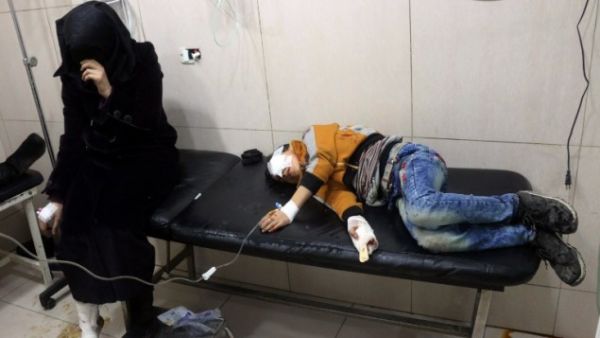 Wounded Syrians are seen on a table in a crowded makeshift hospital in eastern Aleppo. (AFP/File)