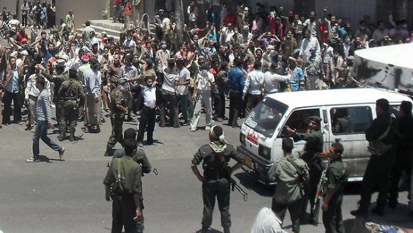 Demonstrators confront security forces during a protest against the rule of President Ali Abdullah Saleh in Yemen's southwestern city of Taiz in 2011. (AFP/File) 