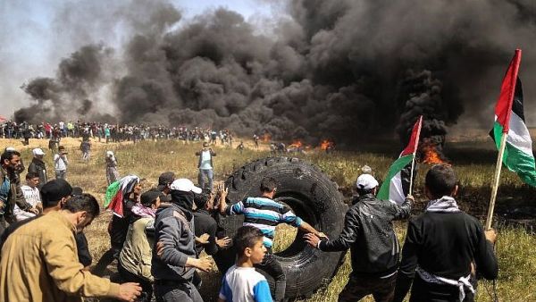 Tires being burned in Gaza (AFP/MAHMUD HAMS)
