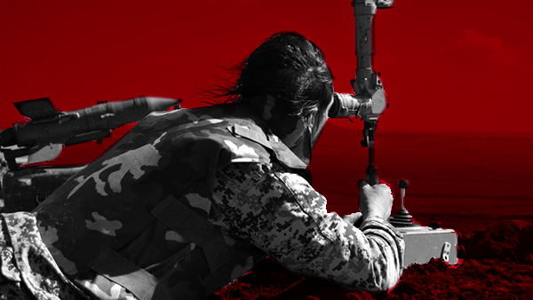 A soldier looks onto the battlefield in southern Syria, 2015 (Ramy Khoury/Al Bawaba)