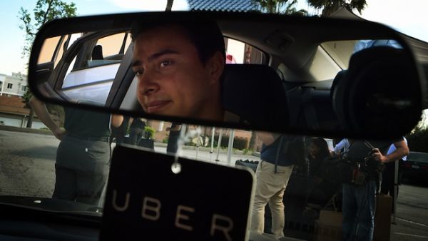 Uber has been given three dedicated areas to transport passengers to and from King Khalid International Airport.
 (Mark Ralston/ AFP)