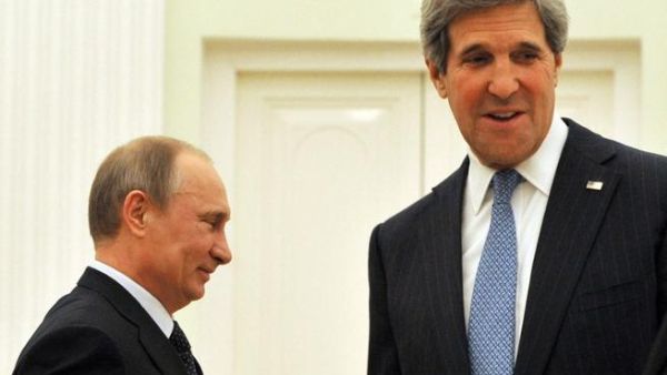  Russian President Vladimir Putin (L) and the US Secretary of State John Kerry take their seats prior their talks in Kremlin in Moscow. (AFP PHOTO/POOL/MLADEN ANTONOV)