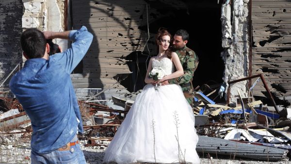 According to AFP, the wedding photographer wanted to show that "life is stronger than death."   (AFP/File)