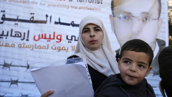 Mohammed al-Qiq's wife, Fayha Shalash and her son Islam, on 31 January, 2016  (AFP/File)