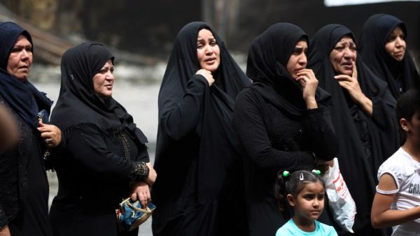 Iraqi women in mourning on July 4, 2016, outside the site of a deadly suicide bombing in Baghdad. (AFP/Ahmad Al-Rubaye)