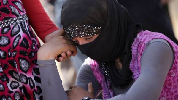 Many women and girls are paraded in 'slave bazaars.' (AFP/File)
