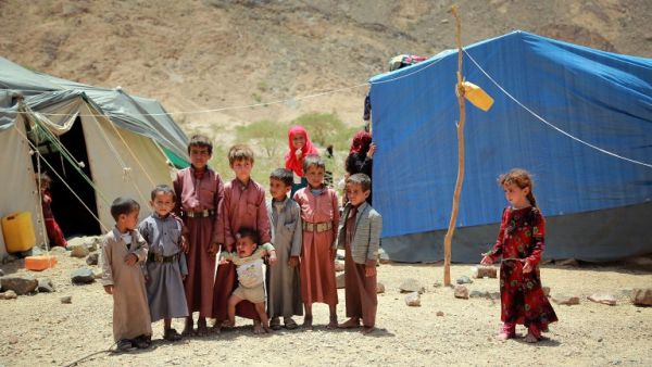 Yemeni children stand outside a tent at a makeshift camp for Internally Displaced Persons (IDPs) after they were forced to flee their homes due to the ongoing fighting in the country, in the Nehm region, west of Marib city, on May 8, 2016. (AFP/Abdullah al-Qadri)