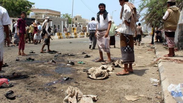 Yemenis gather at the site of a twin bombing that targeted Yemeni forces in the southern city of Aden on May 23, 2016. (AFP/Saleh al-Obeidi)