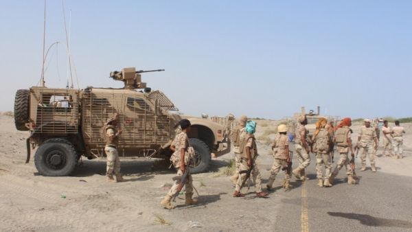 Yemeni pro-government fighters walk in front of a military vehicle, before heading to Zinjibar, the capital of Yemen's southern province of Abyan, to launch an offensive to recapture the town from al-Qaeda on August 14, 2016. (AFP/Saleh al-Obeidi)