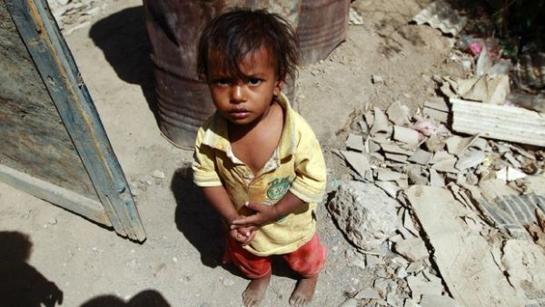 A child in Yemen stands among rubble, AFP