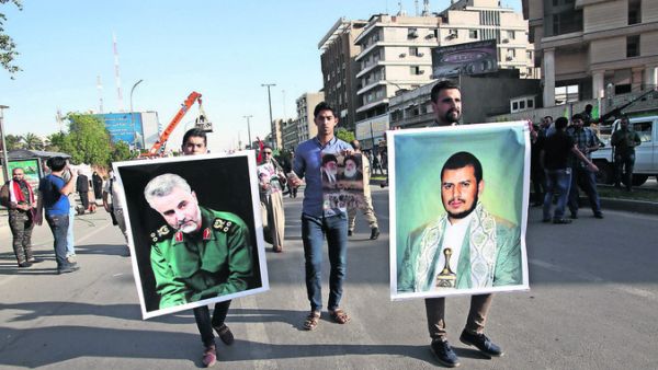 The Saudi-led coalition is battling Shia Houthis, led by Abdul-Malik al-Houthi (right) and is said to be backed by Iranian forces under the command of General Qassem Suleimani (left). (AFP/Ali Al-Saadi)