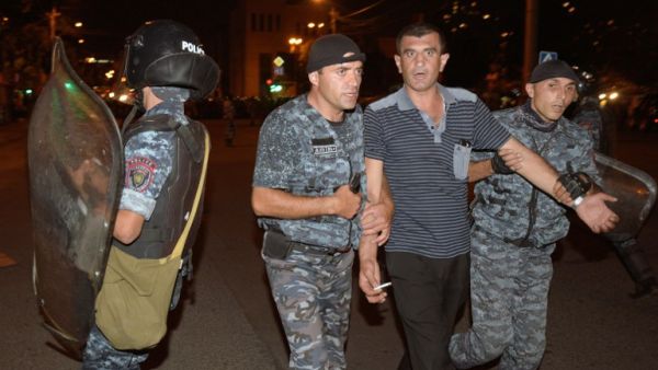 Armenian police detain opposition supporters blocking a street leading to Erebuni police station seized by gunmen - supporters of fringe jailed opposition leader Zhirair Sefilyan - in Yerevan late on July 29, 2016. (AFP/Karen Minasyan)