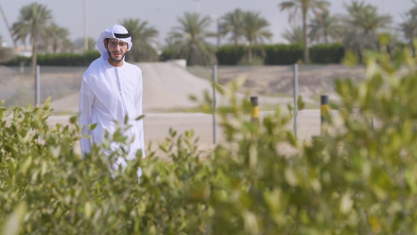 Mohamed Al Ghailani, Regional Lead, Global Sustainability Policy & Partnerships for Boeing Middle East, Turkey and Africa, visits the Sustainable Bioenergy Research Consortium (SBRC) project in Abu Dhabi, United Arab Emirates. The Boeing- funded project examines how plants called halophytes, which grow in arid/desert regions and can be irrigated with seawater, can be used to make sustainable aviation fuel. (Photo: Boeing) Boeing Expands Global Efforts to Scale-Up Sustainable Aviation Fuels