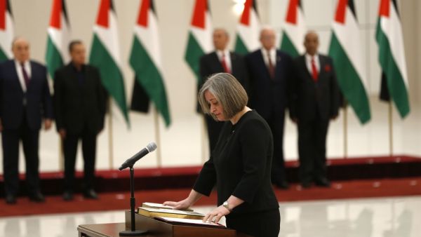 Rola Maayya is sworn in as tourism minister in the new Palestinian government, in the Israeli-occupied West Bank town of Ramallah (AFP)