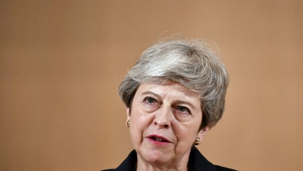 Britain's outgoing Prime Minister Theresa May delivers a speech at the ILO International Labour Conference on June 11, 2019 in Geneva.  FABRICE COFFRINI / AFP