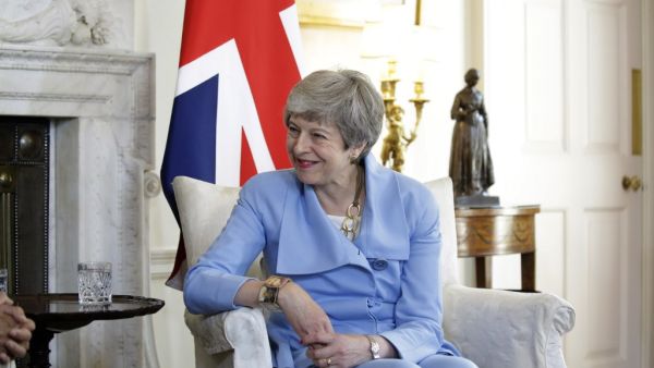 British Prime Minister Theresa May speaks with Afghanistan's President Ashraf Ghani at the start of their meeting inside 10 Downing Street in London on June 17, 2019.  Matt Dunham / POOL / AFP