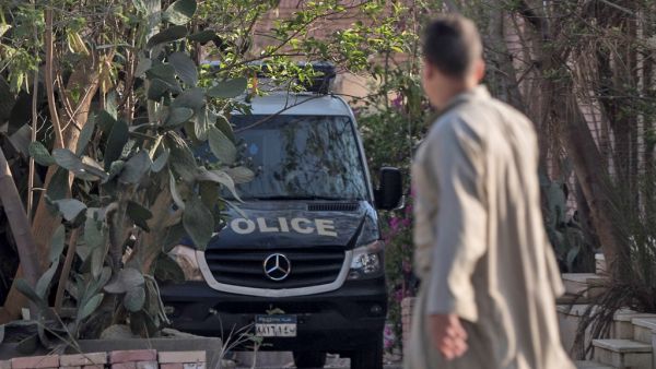 An Egyptian police Vehicle is parked inside a cemetery after the former Egyptian President Mohamed Morsi was buried in Cairo on June 18, 2019.  Khaled DESOUKI / AFP
