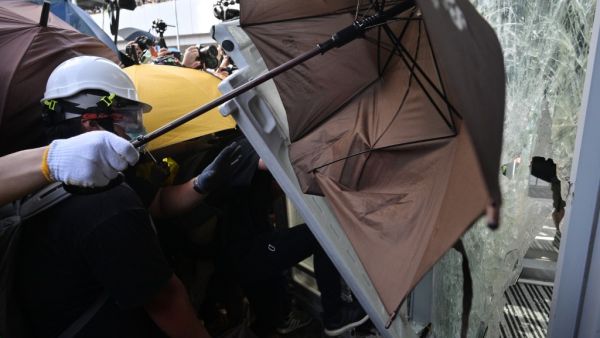 Protesters attempt to enter the government headquarters in Hong Kong  (AFP)
