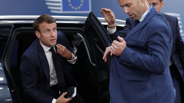 French President Emmanuel Macron arrives for the third straight day of a European Union leaders summit in Brussels on July 2, 2019, for talks aimed at defusing fresh power struggles in a bid to fill the bloc's top jobs.  GEOFFROY VAN DER HASSELT / AFP / POOL