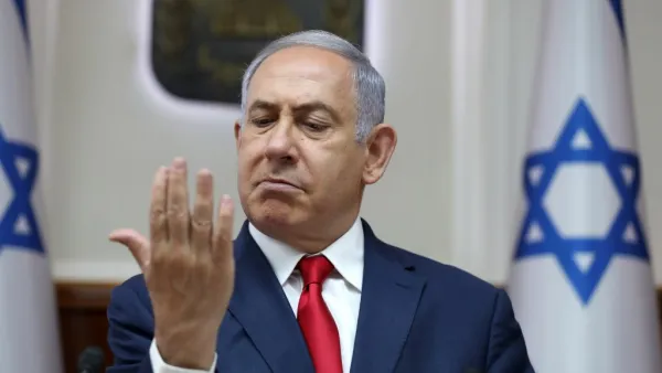 Israeli Prime Minister Benjamin Netanyahu looks at his hand as he chairs the weekly cabinet meeting at his office in Jerusalem on July 7, 2019.  ABIR SULTAN / POOL / AFP