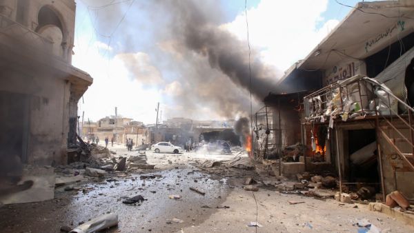 Smoke billows following an airstrike by Syrian regime forces  (AFP)
