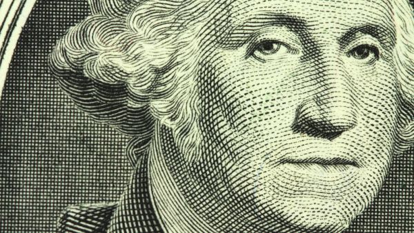 New one dollar bill closeup (Shutterstock)