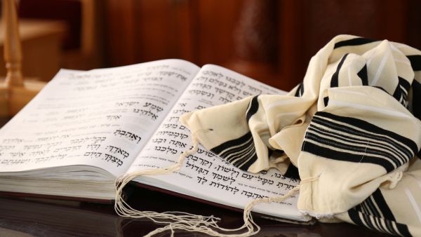 Tallit Jewish religious symbol and Jewish Prayer (Shutterstock)	