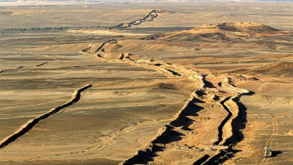 A wall runs through the Western Sahara for over a thousand miles /AFP